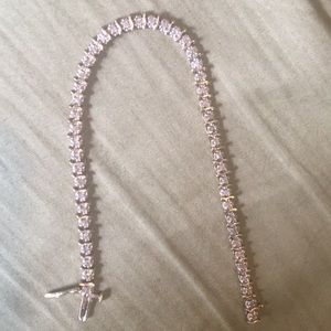 10k tennis bracelet **one stone is missing